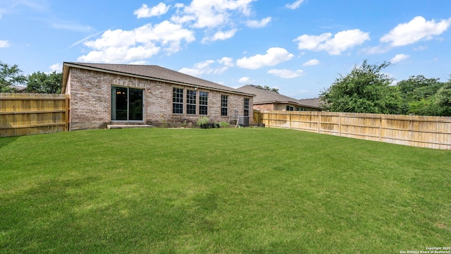 8023 Jalane Oaks, San Antonio, TX 78255 - rear view of property featuring brick siding and a fenced backyard