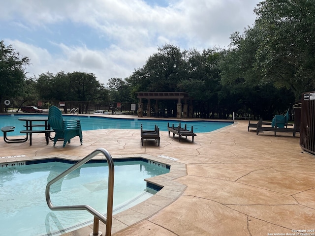 8023 Jalane Oaks, San Antonio, TX 78255 - community pool featuring a patio area, a pergola, and view of wooded area