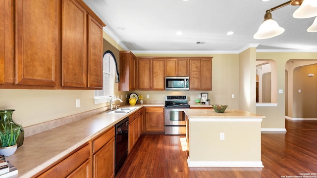 8023 Jalane Oaks, San Antonio, TX 78255 - kitchen featuring appliances with stainless steel finishes, ornamental molding, dark wood-style floors, light countertops, and brown cabinetry