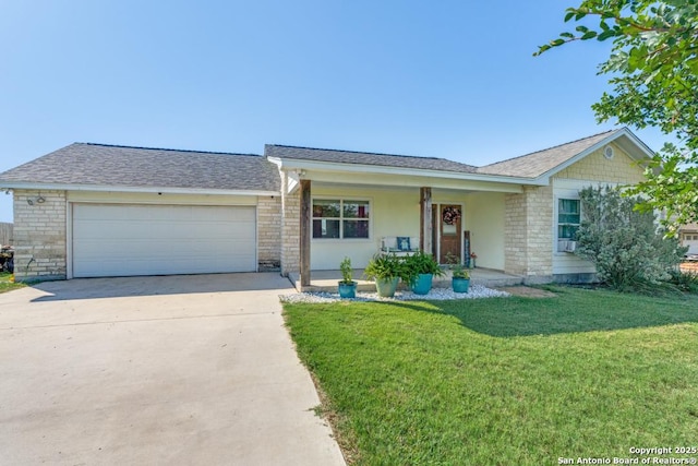 812 Riviere, Falls City, TX 78113 - ranch-style house with driveway, stone siding, a front yard, an attached garage, and roof with shingles
