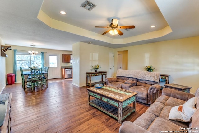 812 Riviere, Falls City, TX 78113 - living room with a tray ceiling, ceiling fan, a chandelier, wood finished floors, and recessed lighting