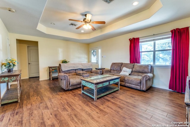 812 Riviere, Falls City, TX 78113 - living area featuring a raised ceiling, ceiling fan, plenty of natural light, wood finished floors, and recessed lighting