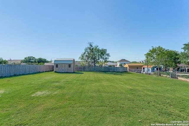 812 Riviere, Falls City, TX 78113 - fenced backyard featuring a storage unit