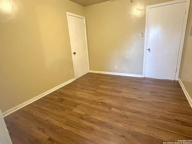 806 Ceralvo, San Antonio, TX 78207 - unfurnished room with dark wood finished floors and baseboards