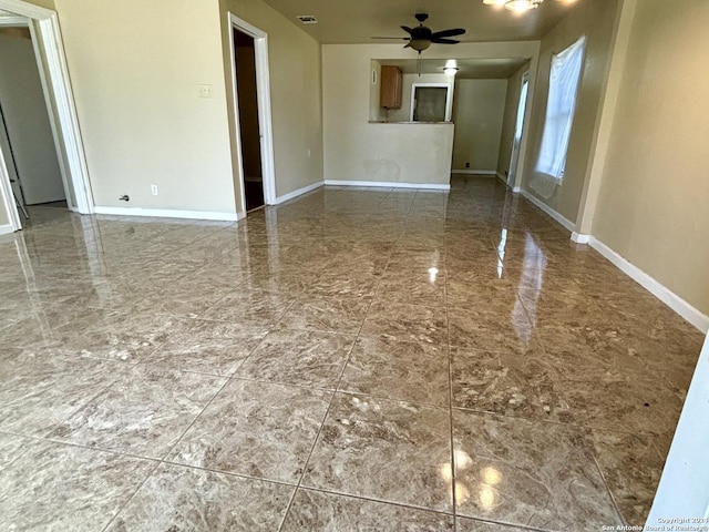 806 Ceralvo, San Antonio, TX 78207 - unfurnished living room featuring ceiling fan and marble finish floors