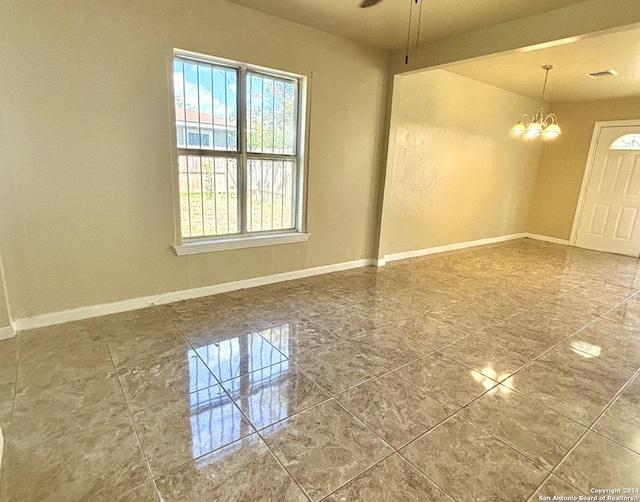 806 Ceralvo, San Antonio, TX 78207 - empty room with a chandelier and ceiling fan