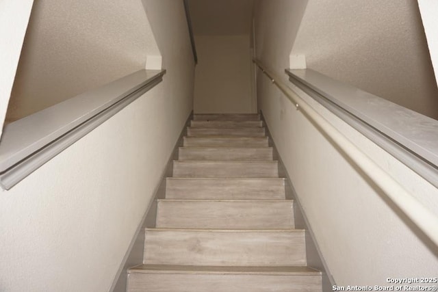 5615 Camry Spgs, San Antonio, TX 78251 - stairway featuring wood finished floors
