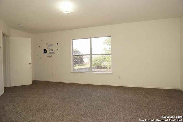 5615 Camry Spgs, San Antonio, TX 78251 - empty room with dark carpet and a textured ceiling