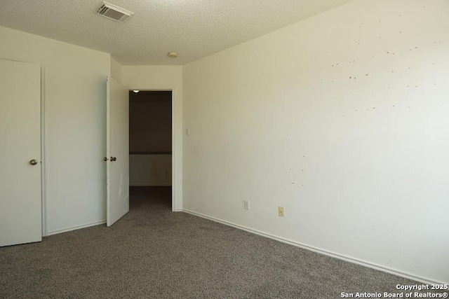 5615 Camry Spgs, San Antonio, TX 78251 - carpeted empty room with a textured ceiling
