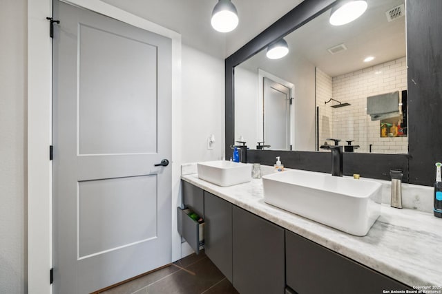 818 Martin Luther King, San Antonio, TX 78203 - bathroom featuring double vanity, tiled shower, and tile patterned floors
