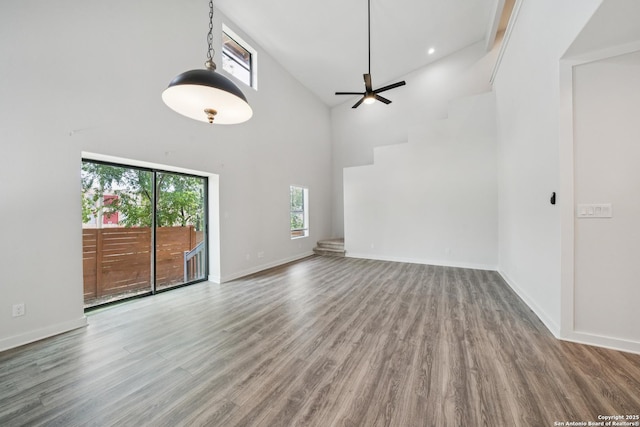 818 Martin Luther King, San Antonio, TX 78203 - unfurnished living room featuring wood finished floors, ceiling fan, and high vaulted ceiling