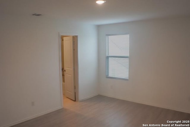 7119 Satellite Way, San Antonio, TX 78252 - empty room with wood finished floors and baseboards