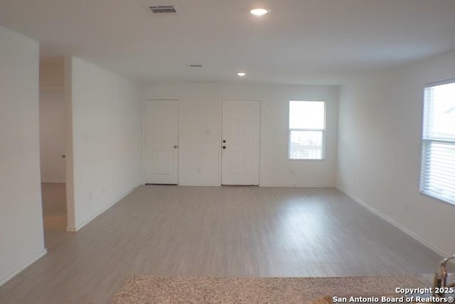 7119 Satellite Way, San Antonio, TX 78252 - empty room featuring light wood finished floors and recessed lighting