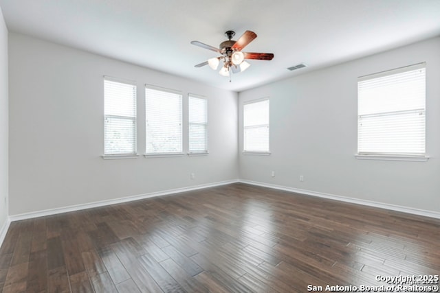 18306 Muir Glen Dr, San Antonio, TX 78257 - empty room with a ceiling fan and dark wood-type flooring