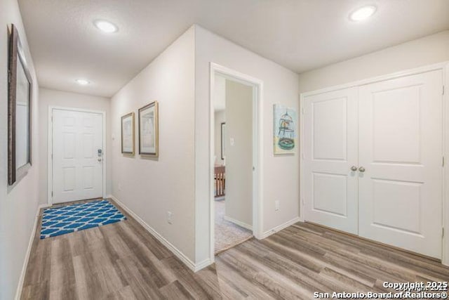 212 Agave Cir, Jourdanton, TX 78026 - corridor featuring wood finished floors and recessed lighting