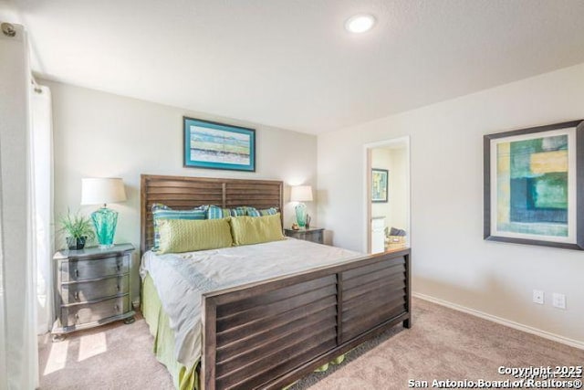 212 Agave Cir, Jourdanton, TX 78026 - bedroom featuring carpet, ensuite bath, and recessed lighting