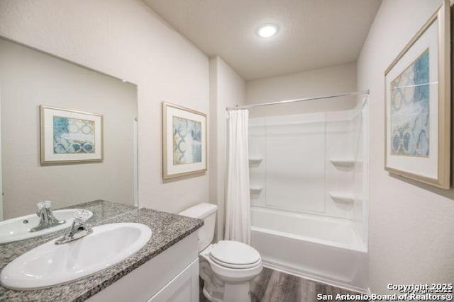 212 Agave Cir, Jourdanton, TX 78026 - bathroom with vanity, wood finished floors, and shower / bathtub combination with curtain