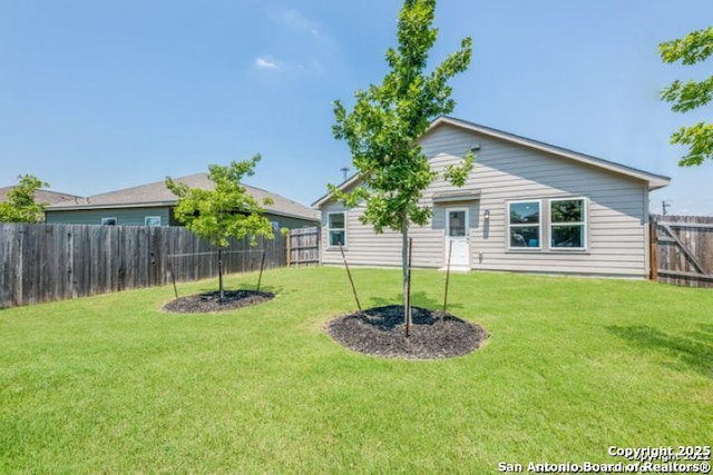 212 Agave Cir, Jourdanton, TX 78026 - rear view of house featuring a fenced backyard
