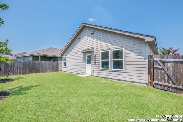 212 Agave Cir, Jourdanton, TX 78026 - rear view of property featuring a fenced backyard