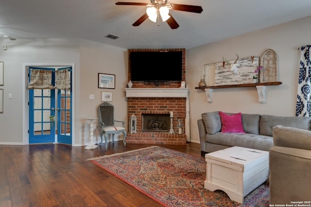 1154 Kite, New Braunfels, TX 78130 - living room with a ceiling fan, wood finished floors, a fireplace, and baseboard heating