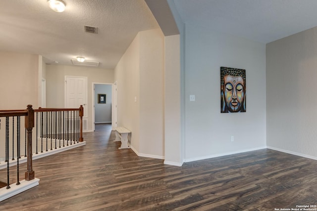 1154 Kite, New Braunfels, TX 78130 - hall featuring dark wood-style flooring, an upstairs landing, and arched walkways