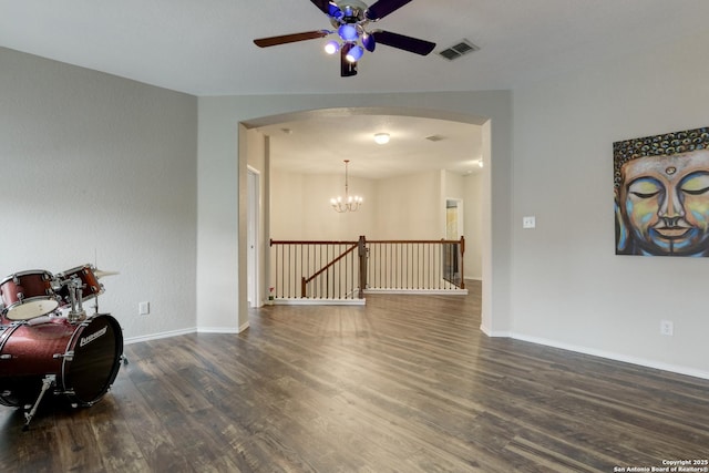 1154 Kite, New Braunfels, TX 78130 - spare room featuring arched walkways, wood finished floors, ceiling fan, and a chandelier