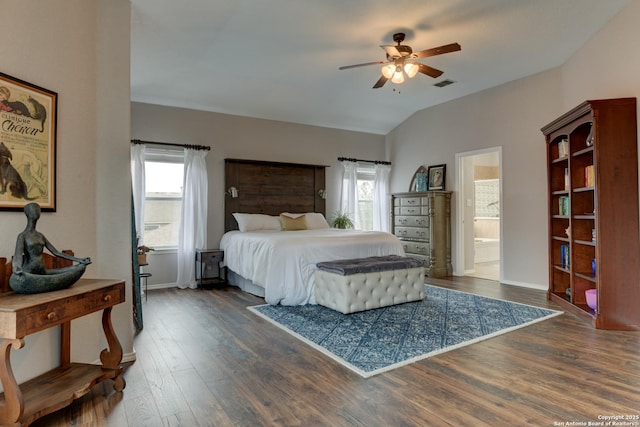 1154 Kite, New Braunfels, TX 78130 - bedroom featuring dark wood-style flooring, multiple windows, vaulted ceiling, and ensuite bathroom
