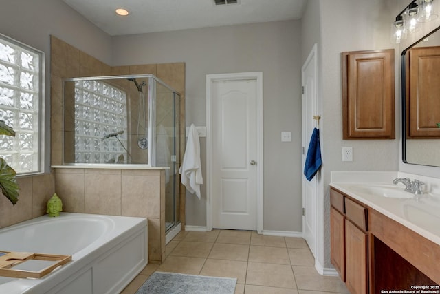 1154 Kite, New Braunfels, TX 78130 - full bathroom featuring vanity, a garden tub, a shower stall, and tile patterned floors