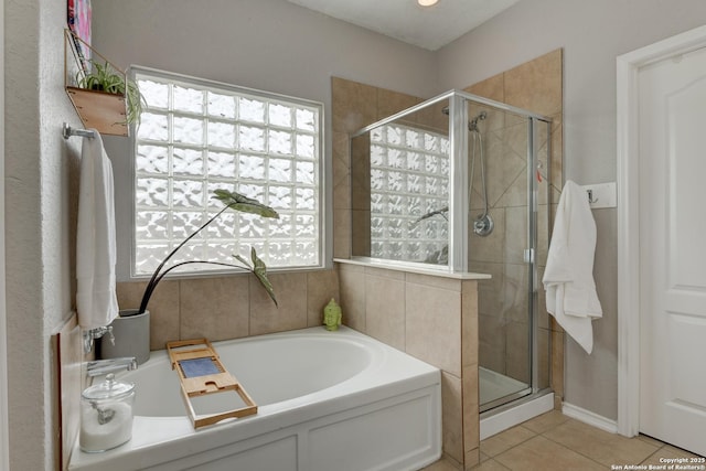 1154 Kite, New Braunfels, TX 78130 - bathroom featuring a bath, a shower stall, and tile patterned flooring
