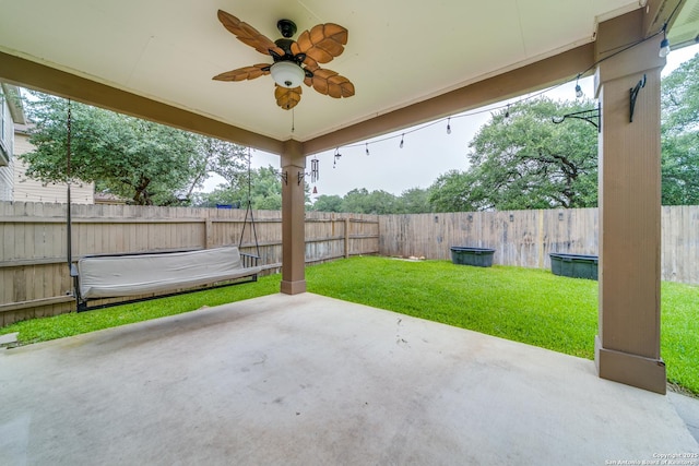129 Sandy Shl, Boerne, TX 78006 - fenced backyard with a ceiling fan and a patio area