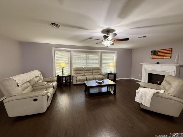 803 Leland, Kenedy, TX 78119 - living room with ceiling fan, dark wood-style flooring, and a fireplace