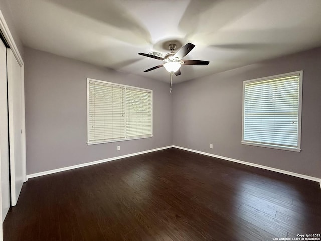 803 Leland, Kenedy, TX 78119 - unfurnished room with a ceiling fan and dark wood finished floors