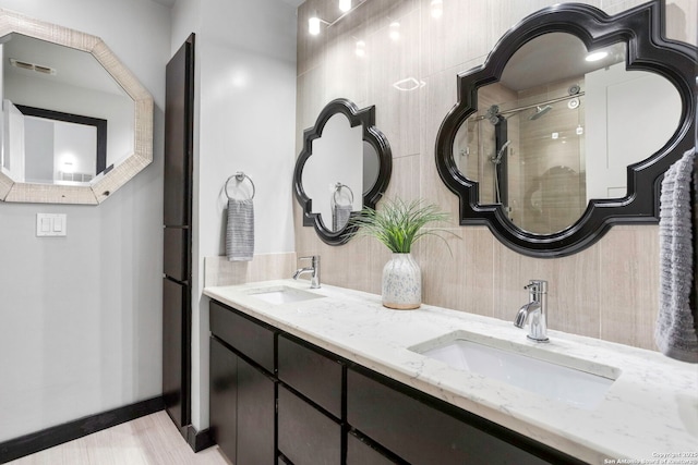 2915 Quail Oak, San Antonio, TX 78232 - bathroom featuring double vanity and a tile shower