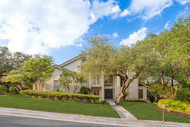 2915 Quail Oak, San Antonio, TX 78232 - view of front of home featuring a front yard and brick siding
