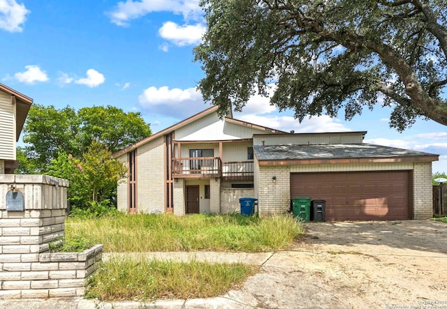 6231 Little Fawn, San Antonio, TX 78238 - view of front of home featuring brick siding, a garage, and driveway