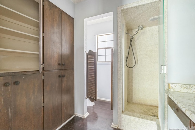 6231 Little Fawn, San Antonio, TX 78238 - bathroom featuring a shower stall, vanity, a closet, and wood finished floors