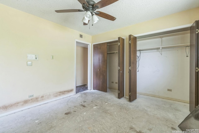 6231 Little Fawn, San Antonio, TX 78238 - unfurnished bedroom with two closets, a textured ceiling, and ceiling fan
