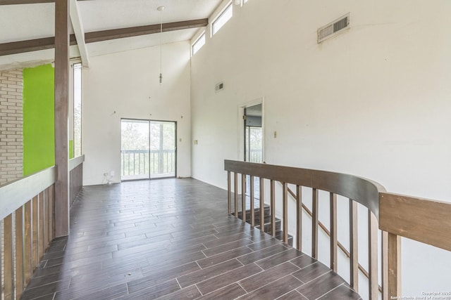 6231 Little Fawn, San Antonio, TX 78238 - hallway featuring beam ceiling, plenty of natural light, dark wood-style flooring, and a high ceiling