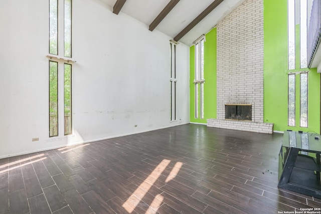6231 Little Fawn, San Antonio, TX 78238 - unfurnished living room with high vaulted ceiling, beamed ceiling, plenty of natural light, wood finished floors, and a fireplace