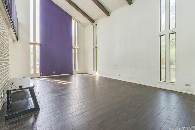 6231 Little Fawn, San Antonio, TX 78238 - unfurnished living room featuring high vaulted ceiling, healthy amount of natural light, beamed ceiling, and dark wood-style flooring