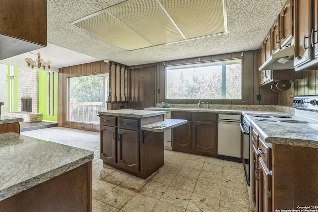 6231 Little Fawn, San Antonio, TX 78238 - kitchen featuring electric range, light flooring, a textured ceiling, a chandelier, and plenty of natural light