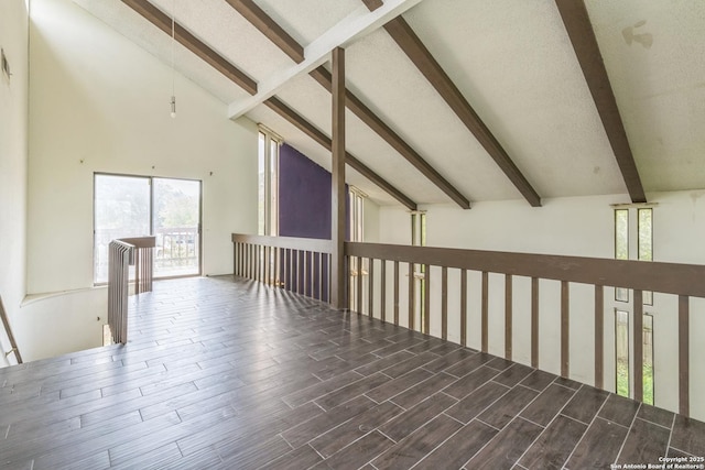 6231 Little Fawn, San Antonio, TX 78238 - empty room featuring beamed ceiling, high vaulted ceiling, and wood finished floors