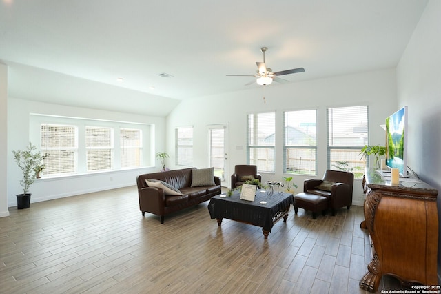 5798 Luciano Trl, Seguin, TX 78155 - living area with healthy amount of natural light, ceiling fan, lofted ceiling, and wood finished floors