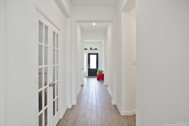5798 Luciano Trl, Seguin, TX 78155 - corridor featuring french doors, wood finished floors, and recessed lighting