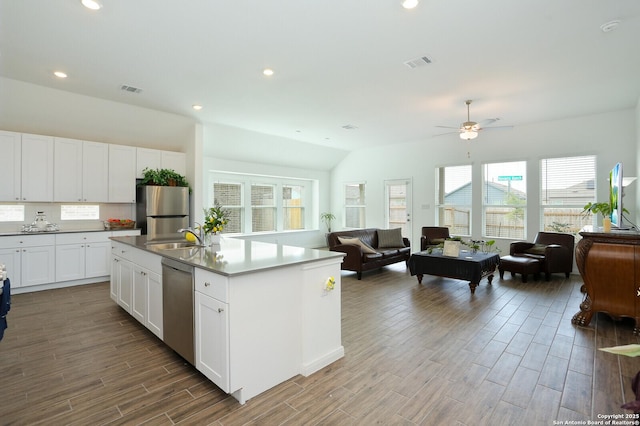 5798 Luciano Trl, Seguin, TX 78155 - kitchen featuring stainless steel appliances, open floor plan, wood finished floors, ceiling fan, and recessed lighting
