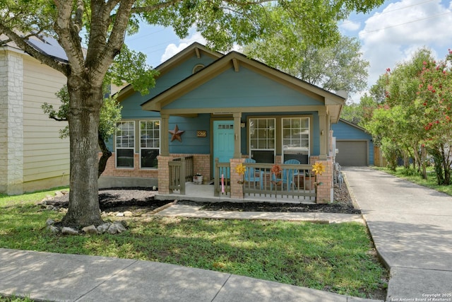 8822 Fernbrook, San Antonio, TX 78250 - view of front of property with covered porch, brick siding, and an outbuilding