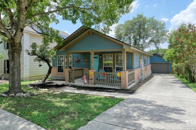 8822 Fernbrook, San Antonio, TX 78250 - view of front of house with a porch, a garage, an outdoor structure, and brick siding