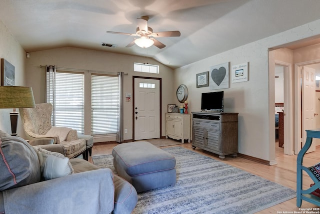 8822 Fernbrook, San Antonio, TX 78250 - living room featuring vaulted ceiling, ceiling fan, and light wood-type flooring