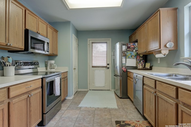 8822 Fernbrook, San Antonio, TX 78250 - kitchen with appliances with stainless steel finishes, light countertops, and light tile patterned floors