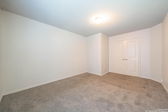 7119 Magnolia Blf, San Antonio, TX 78218 - spare room featuring carpet and baseboards